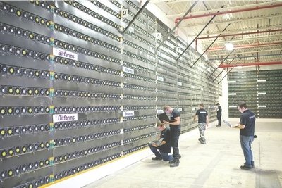 Vast mining farm with rows of ASIC miners humming